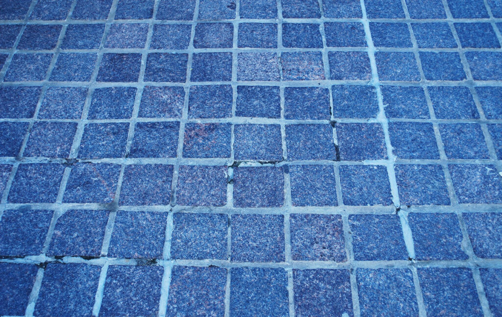 Blue tiles with grout cracks